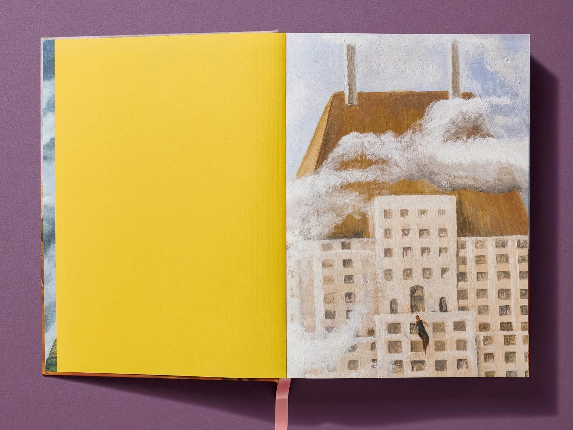 Spread from Frida Kahlo The Complete Paintings with a bright yellow left page and a cityscape painting featuring a figure perched on a building against a brown hill and cloudy sky