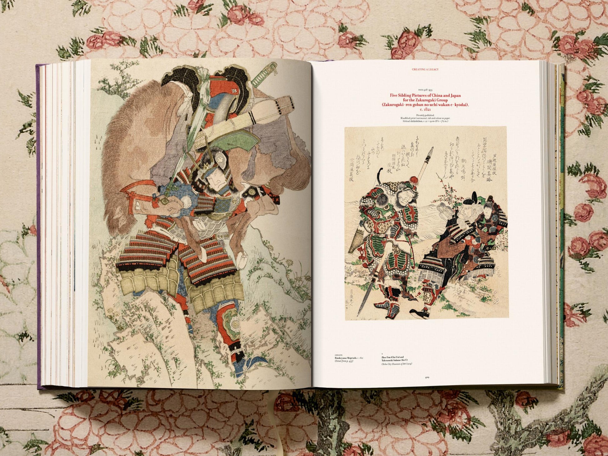 Hokusai volume spread featuring a samurai armor print on the left and a text filled scene on the right.