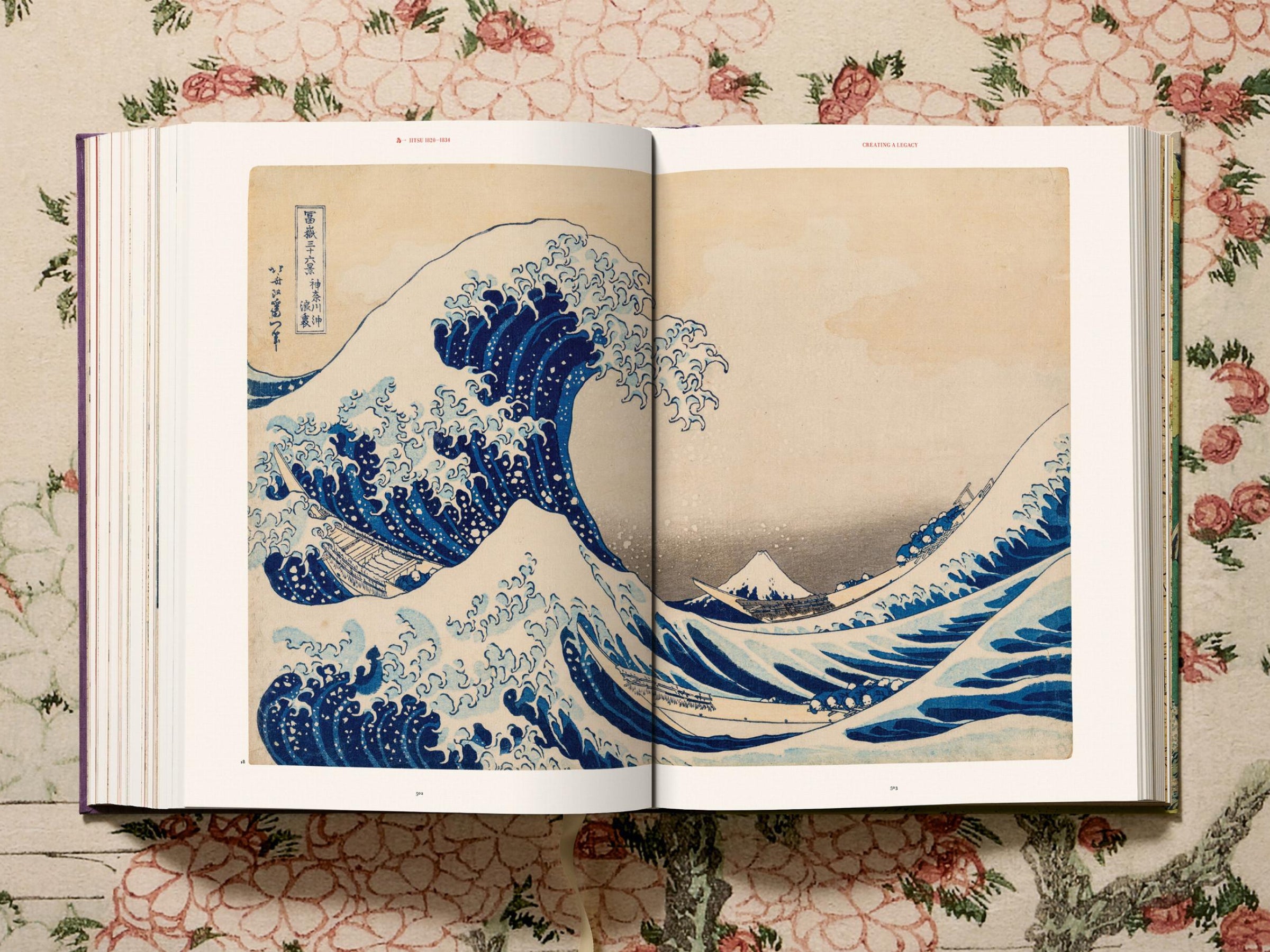 Two page spread from a Hokusai volume showing The Great Wave off Kanagawa with Mount Fuji in the distance