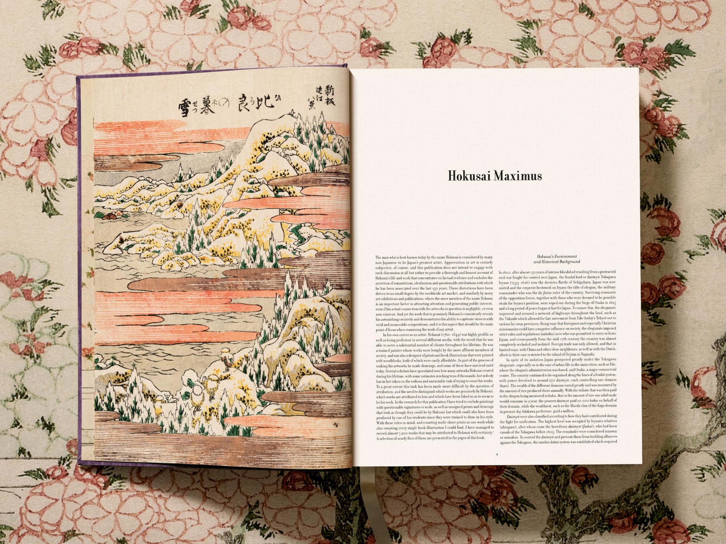 Left page shows a vivid landscape print with Mount Fuji and coastal hills; right page presents a title page that reads Hokusai Maximus.