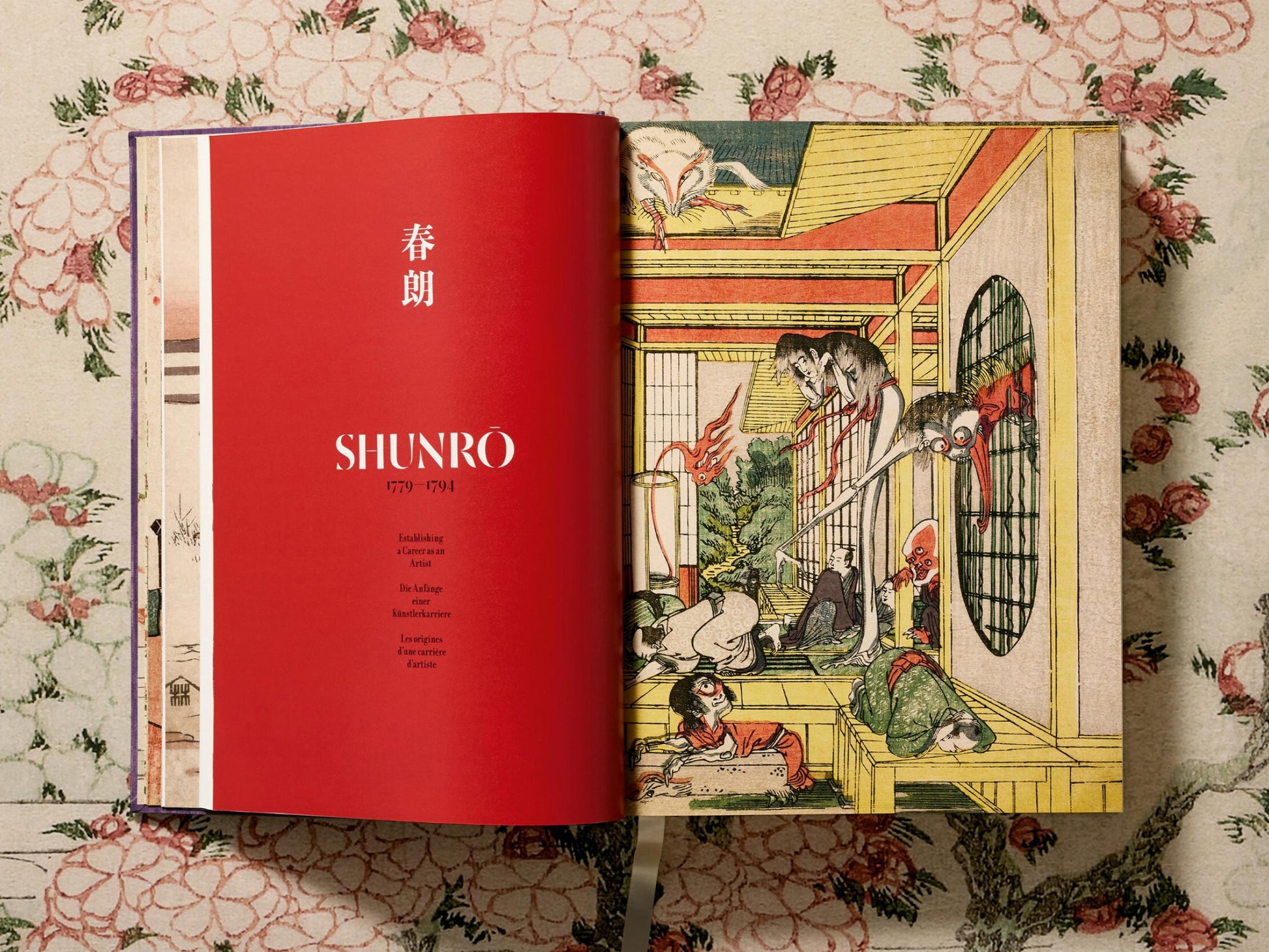 Open Hokusai book spread with a red title page on the left and a dynamic samurai scene on the right