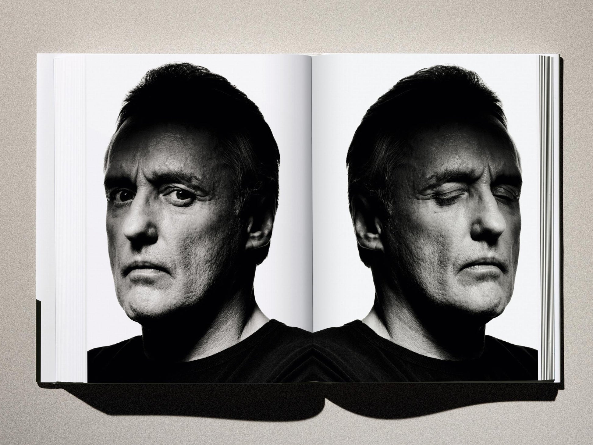 Mirror image portrait of a man's face in black and white from Albert Watson Kaos.