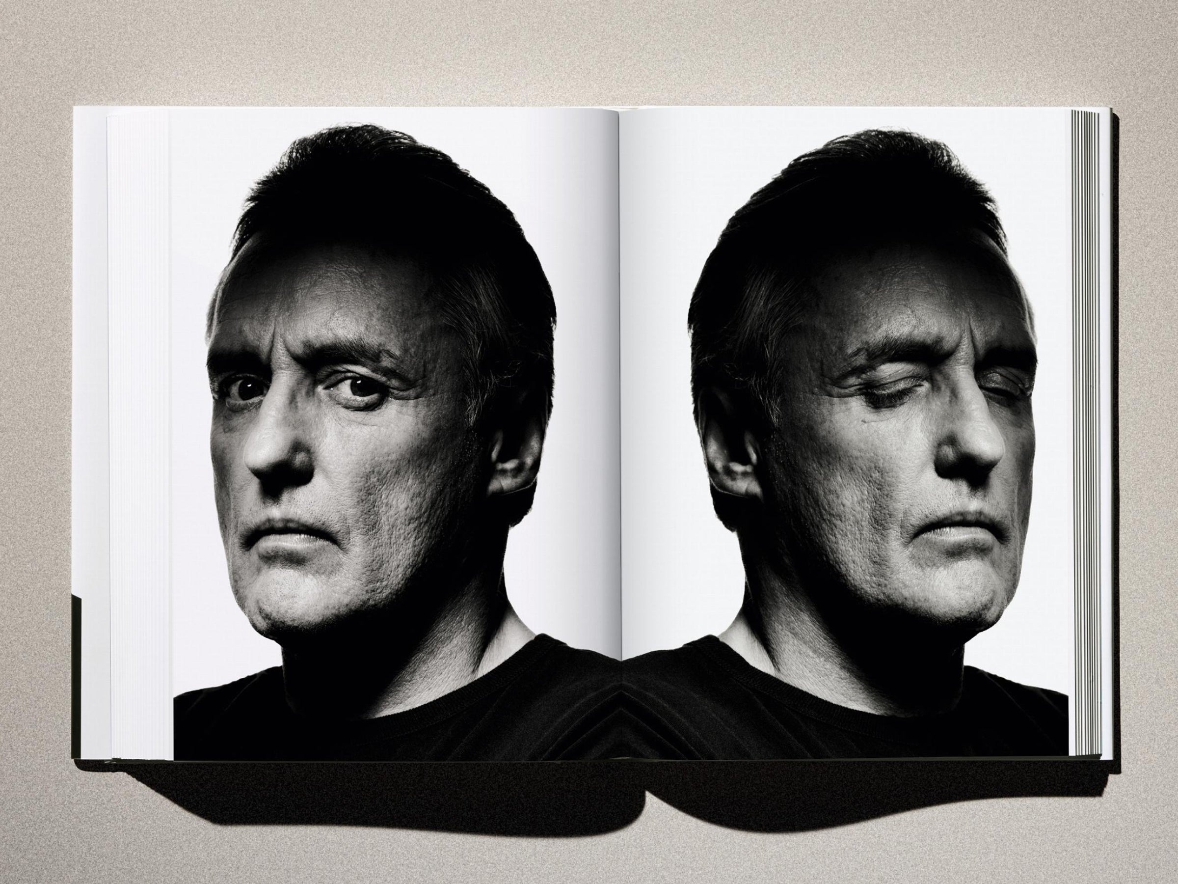 Mirror image portrait of a man's face in black and white from Albert Watson Kaos.