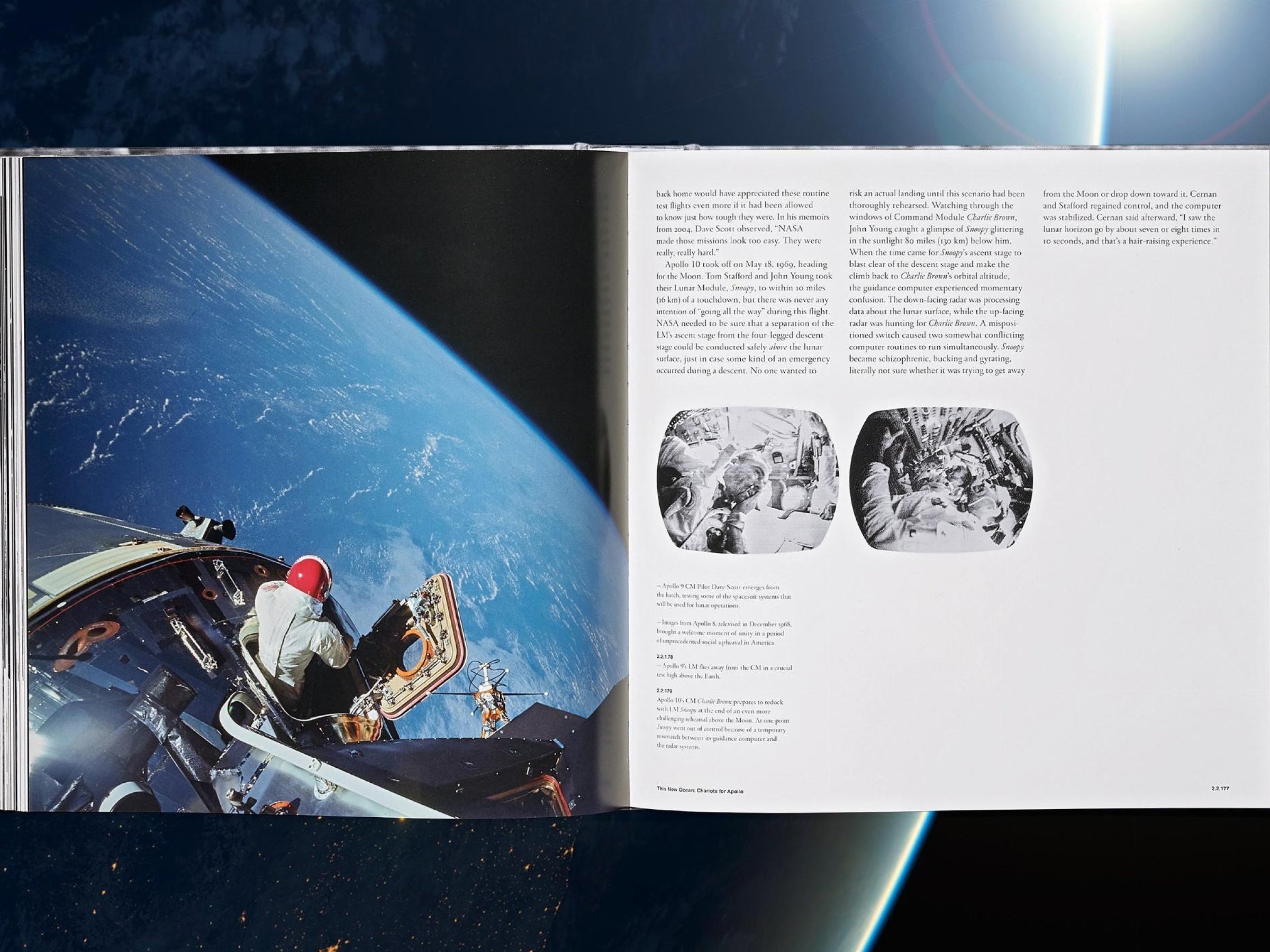 Opened spread from The NASA Archives showing Earth on the left and a text heavy right page with two small black and white images.