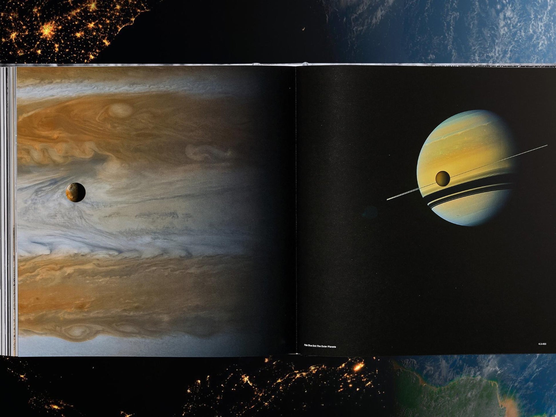 Two page spread shows a swirling banded giant planet on the left and Saturn with rings on the right.