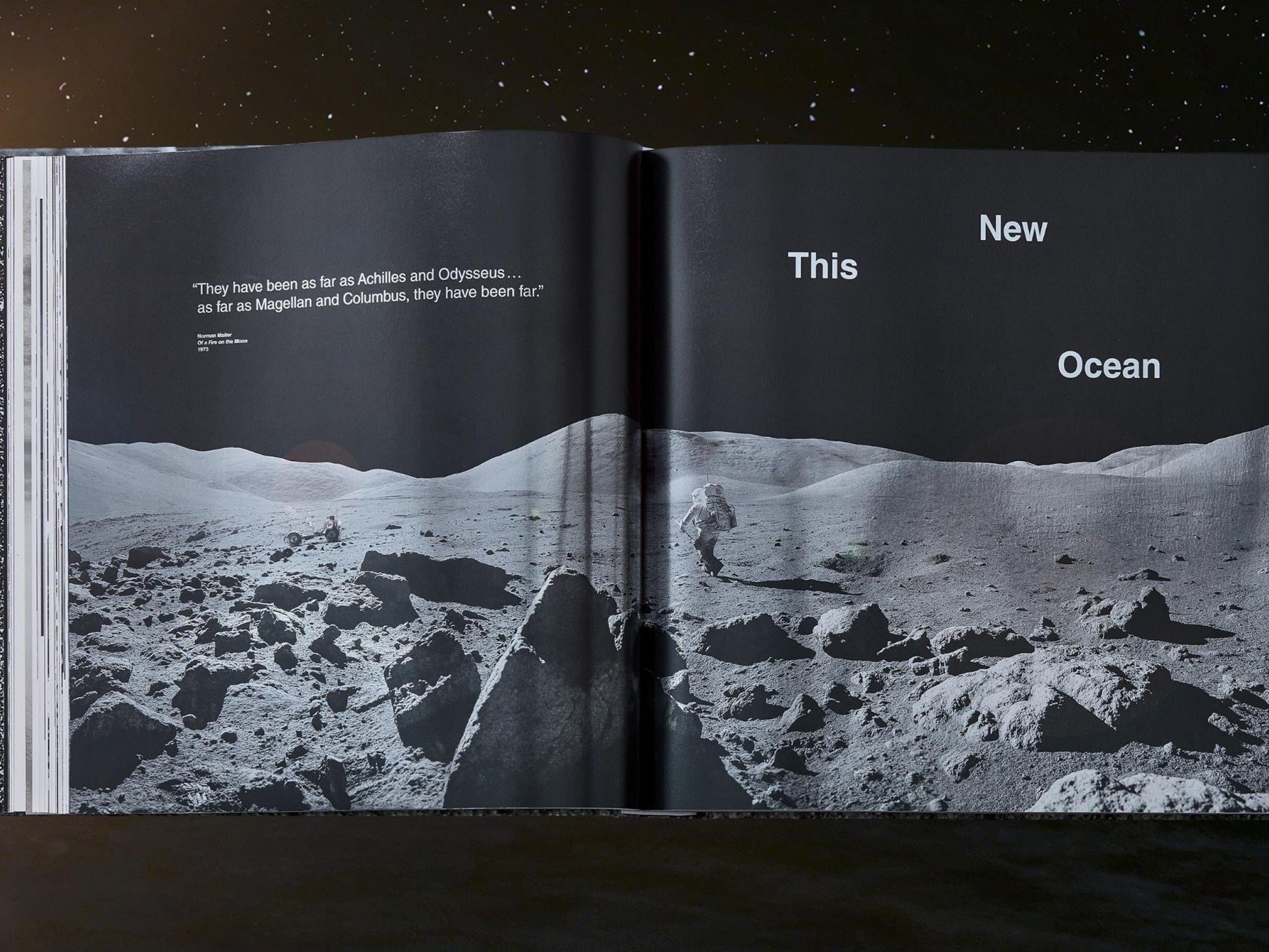 Two page NASA book spread featuring a lunar landscape and astronaut on the left and the headline This New Ocean on the right.