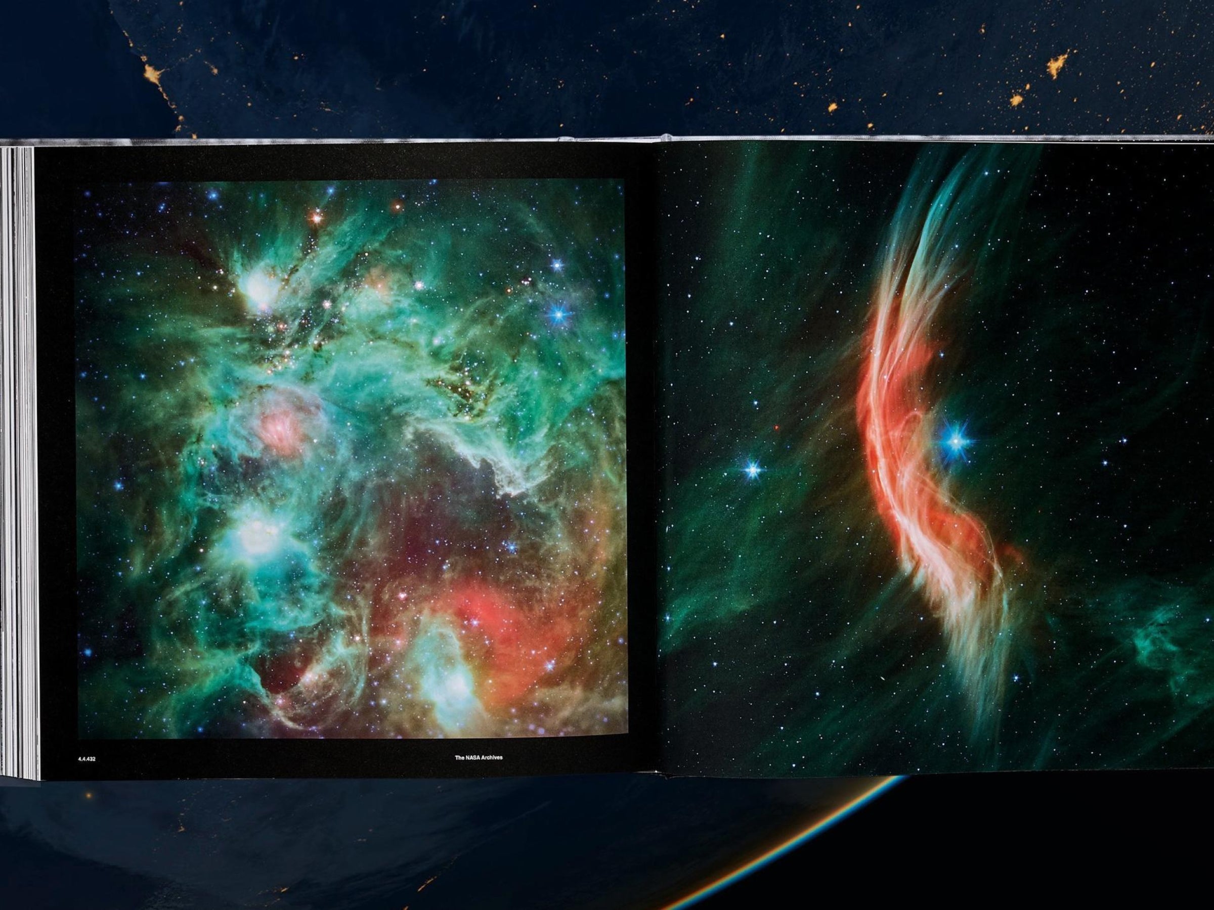 Open spread from The NASA Archives book showing a green blue nebula on the left and a red cosmic plume on the right.
