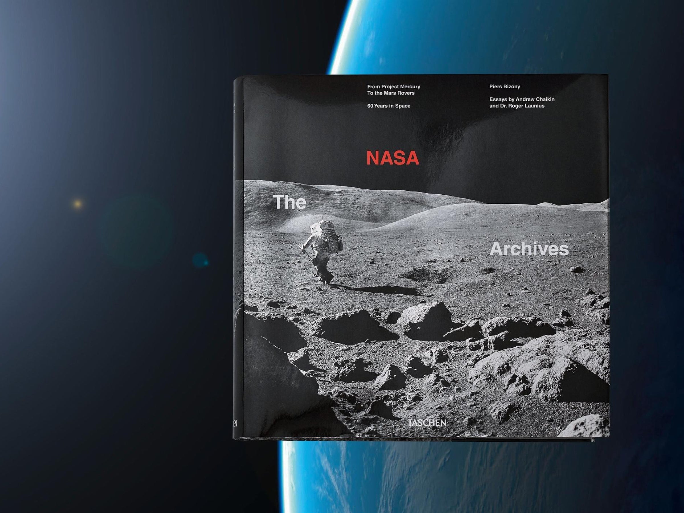 Cover of The NASA Archives book with an astronaut on the Moon against a lunar landscape.