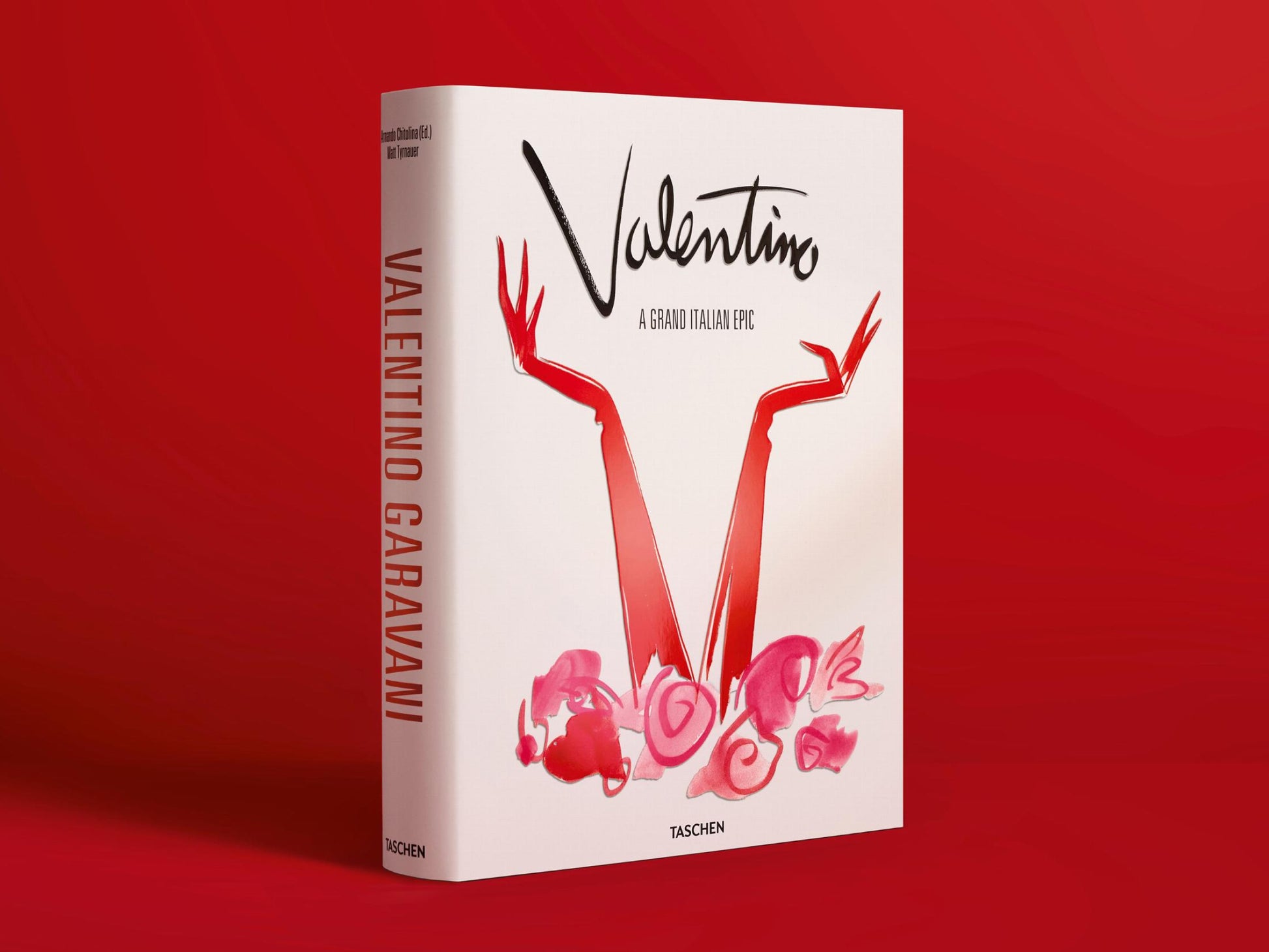 Valentino A Grand Italian Epic book standing against a red backdrop, white cover with red arm illustration.