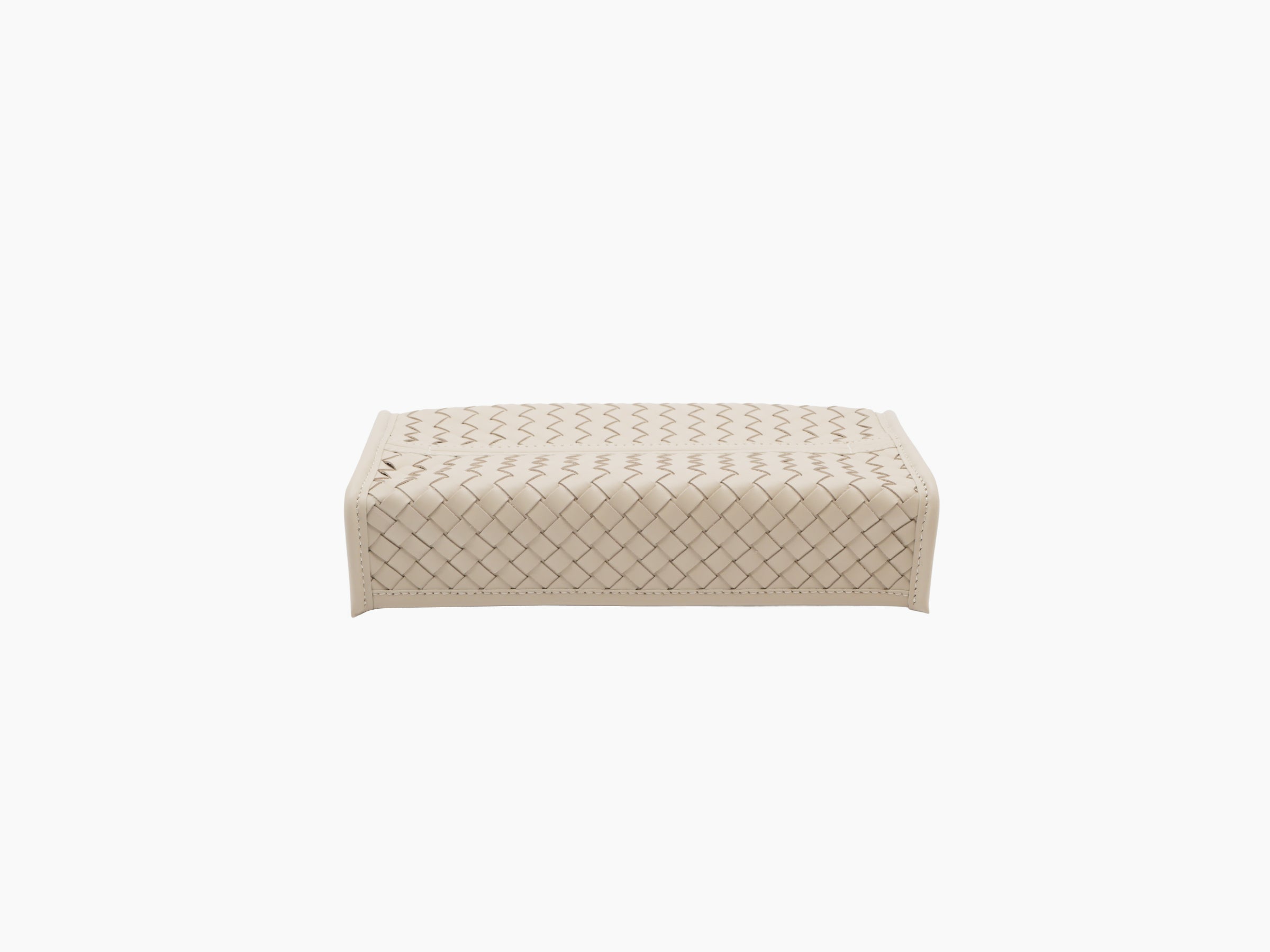 Elba handwoven tissue holder in beige leather viewed from the side with clean stitched edges