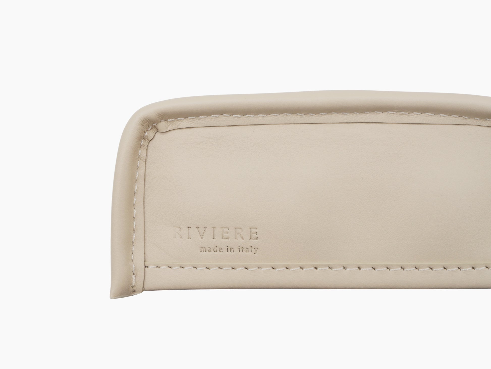 Close up of the tissue holder base showing embossed RIVIERE made in italy and neat stitching