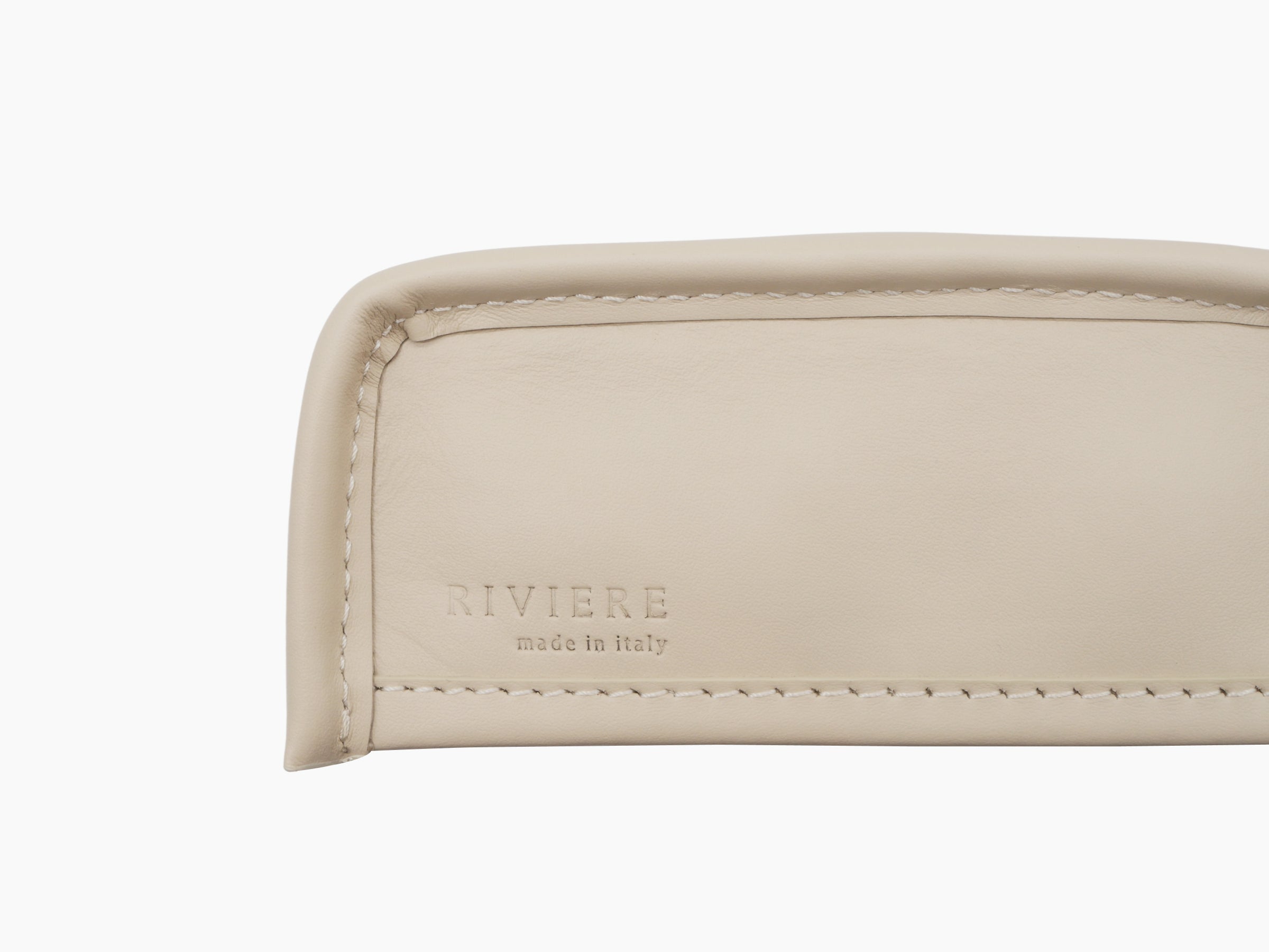 Close up of the tissue holder base showing embossed RIVIERE made in italy and neat stitching