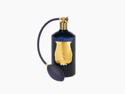 Reggio Hint of citrus from Calabria room spray in deep blue fluted glass with a woven navy pump.