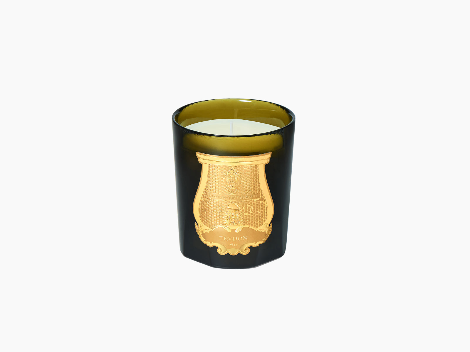 Joséphine Floral Garden candle in dark glass with gold crest beside a navy gift box and perfume bottle on marble.