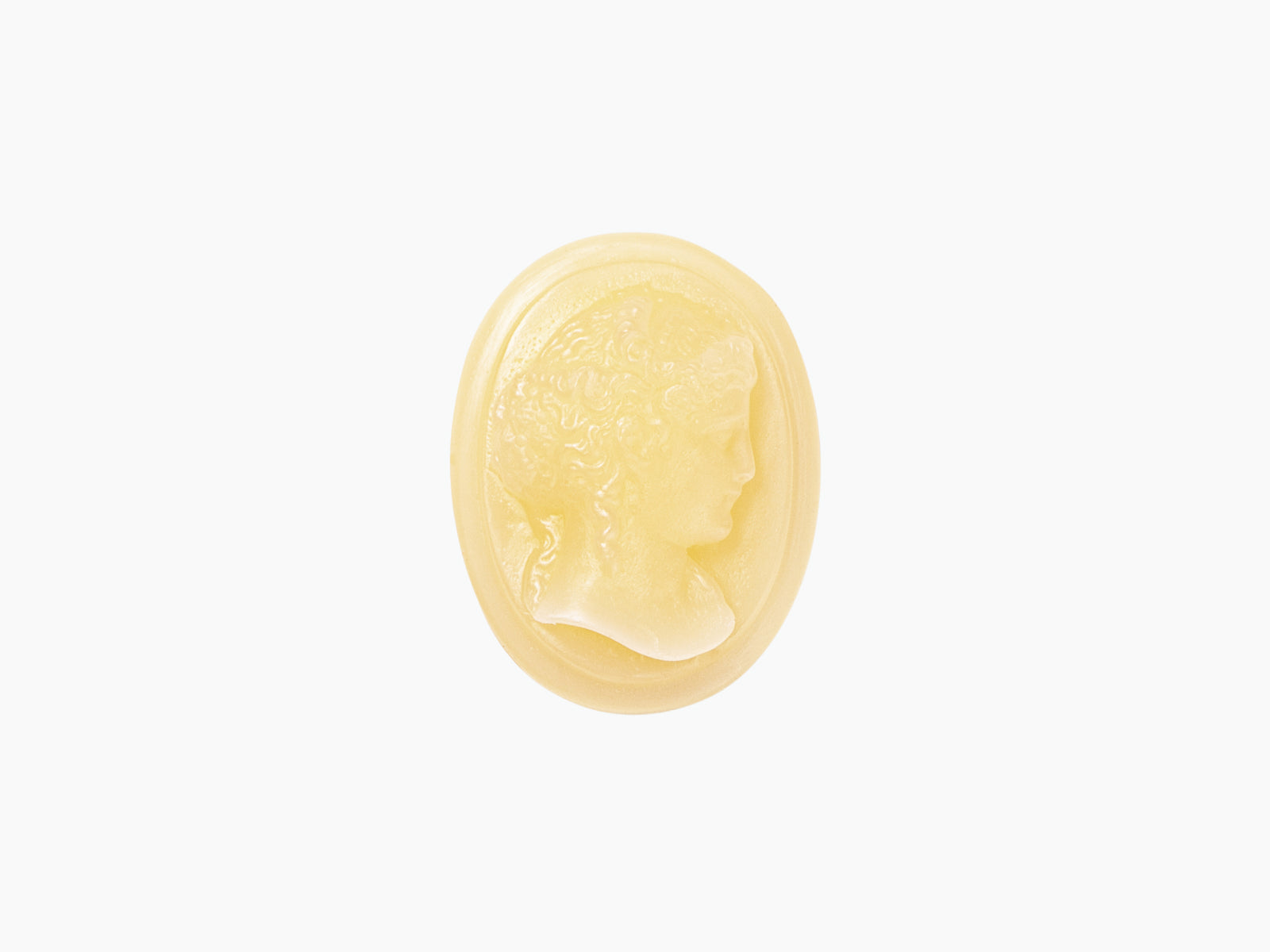 Pale yellow wax cameo resting on an oval ceramic dish from Ernesto Cameo La Promeneuse