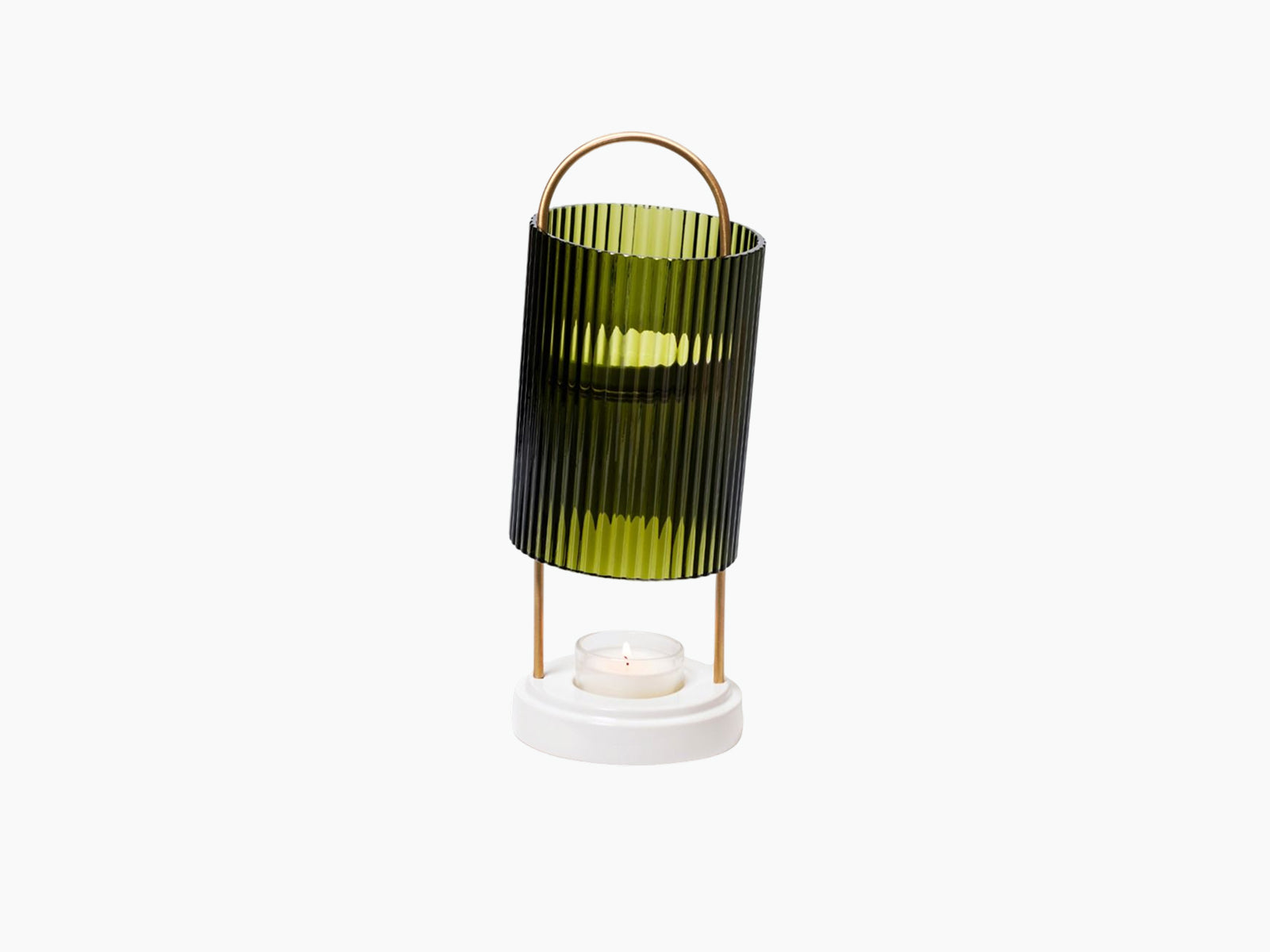 La Promeneuse diffuser with green ribbed glass shade copper handle and lit candle in the white base