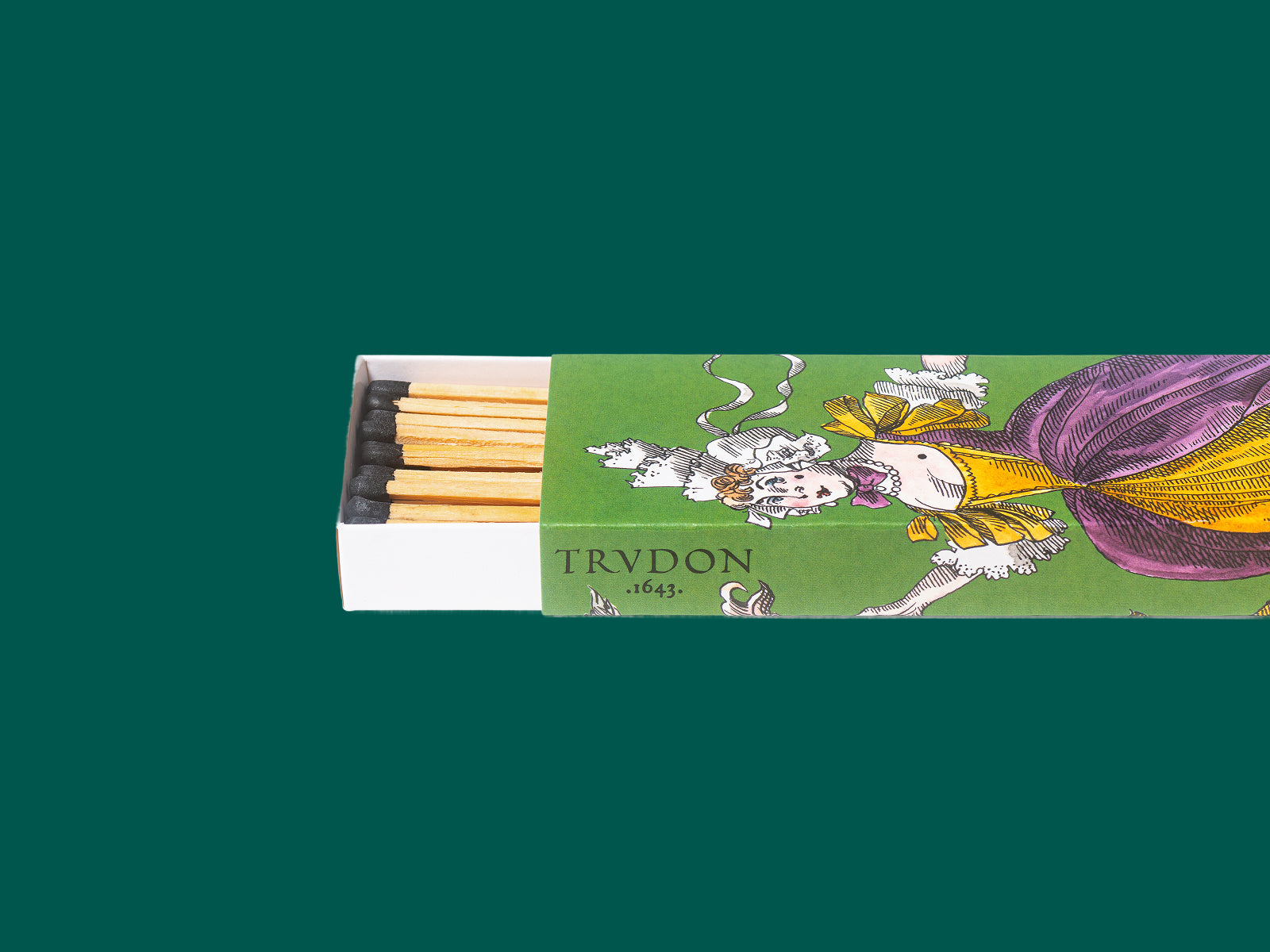 Open green illustrated box of scented matches with long wooden sticks and dark tips, partially slid out of a white tray.