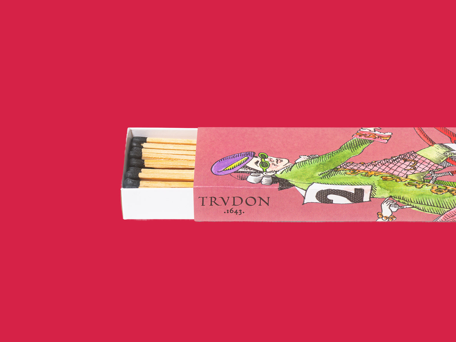 Scendes Matches box from Ernesto Viscounts and Viscountesses with yellow tips peeking from a pink illustrated sleeve on a red background
