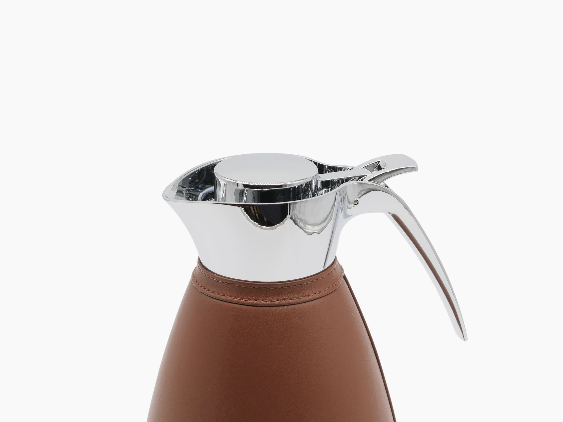 Angled view of Vincennes carafe top showing chrome lid and leather-wrapped body.