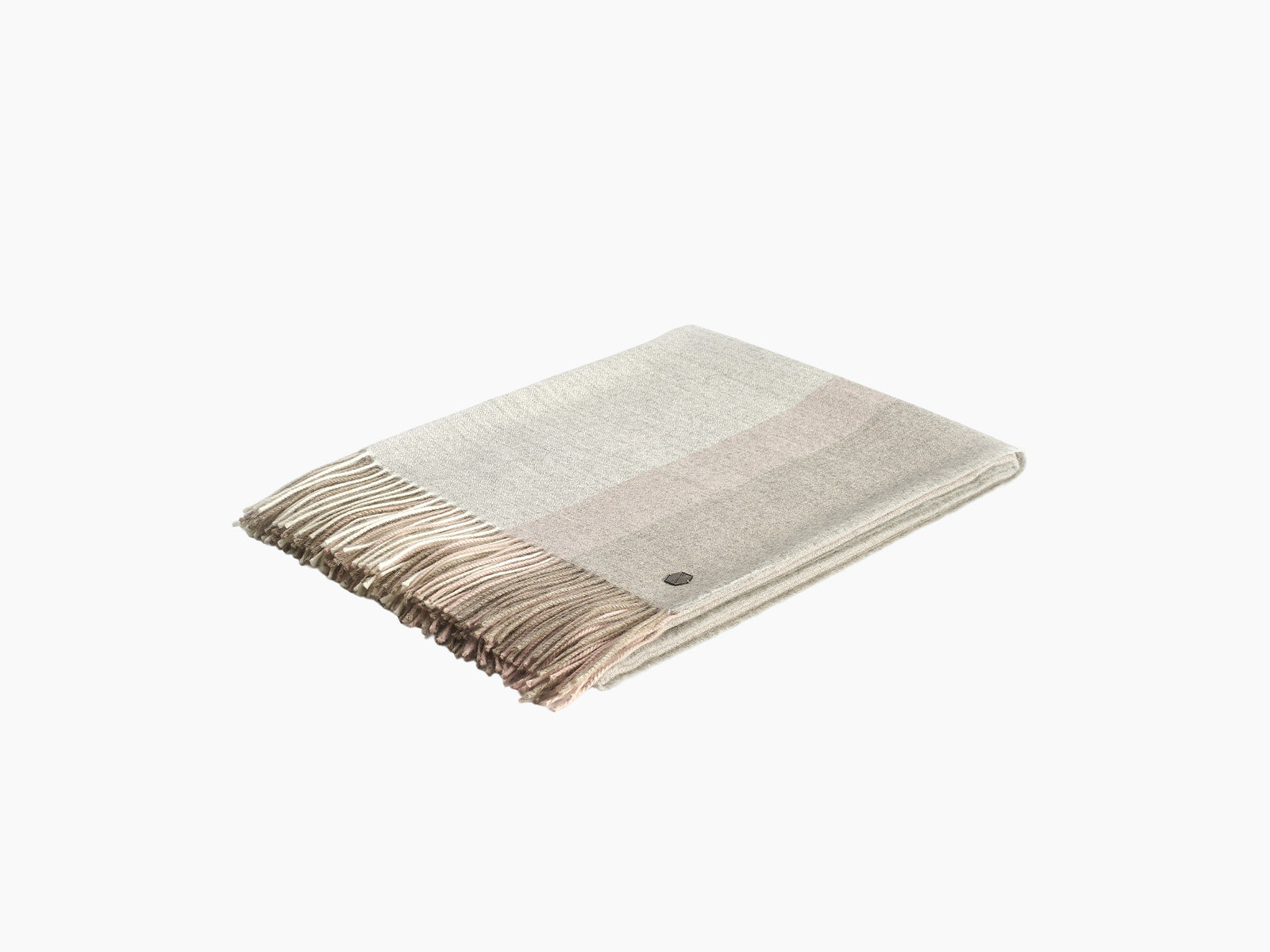 Neutral beige BORREA plaid alpaca wool blanket folded with fringe on a white background.