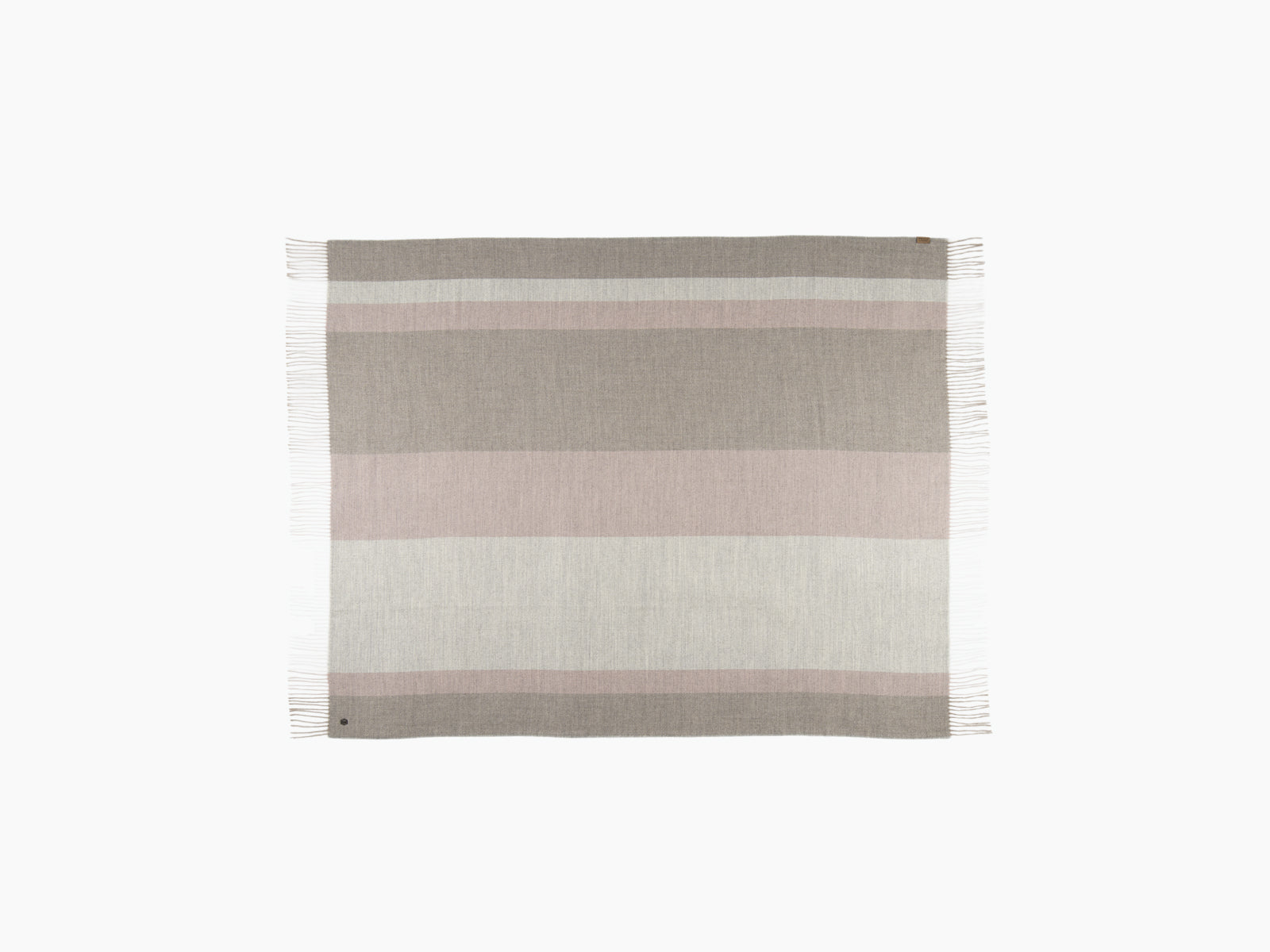 Pastel striped BORREA alpaca wool blanket with fringed edges laid flat