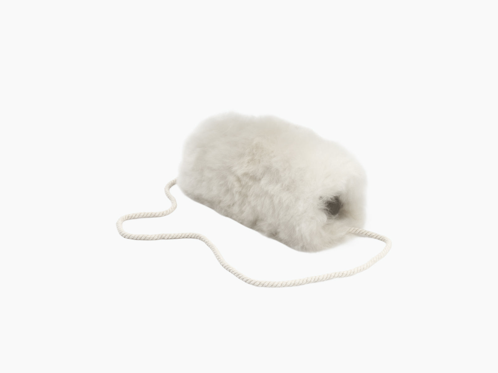 White fluffy alpaca pocket muff with a cream rope cord