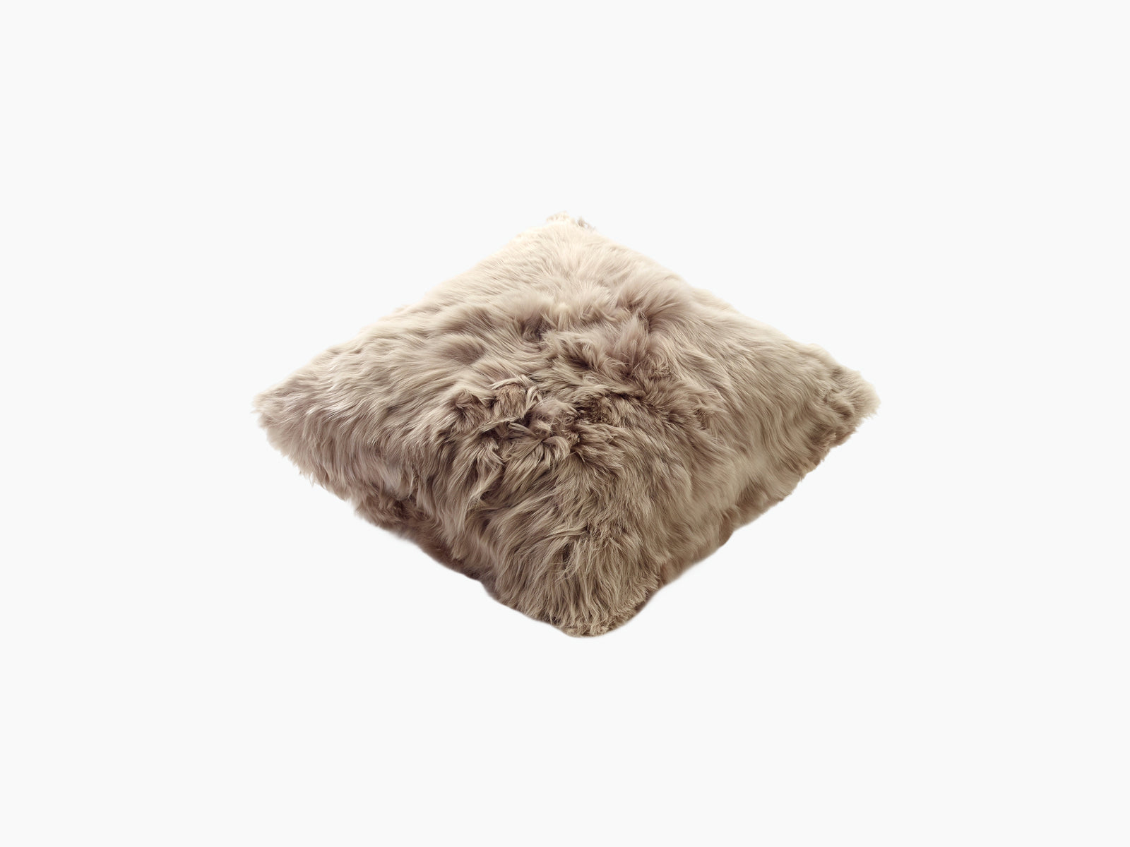Beige fluffy alpaca cushion shown at an angle, highlighting soft long fur and depth