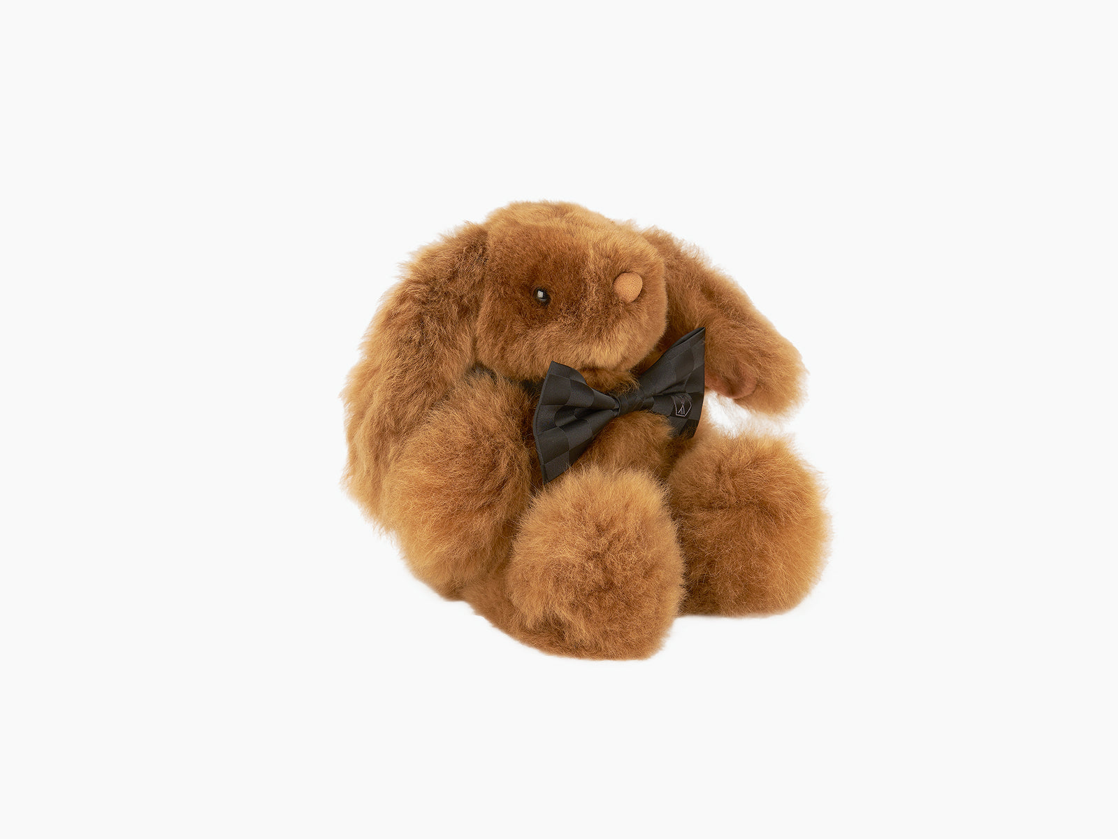 Brown Milo rabbit plush with black bow tie handcrafted from fluffy alpaca fibre