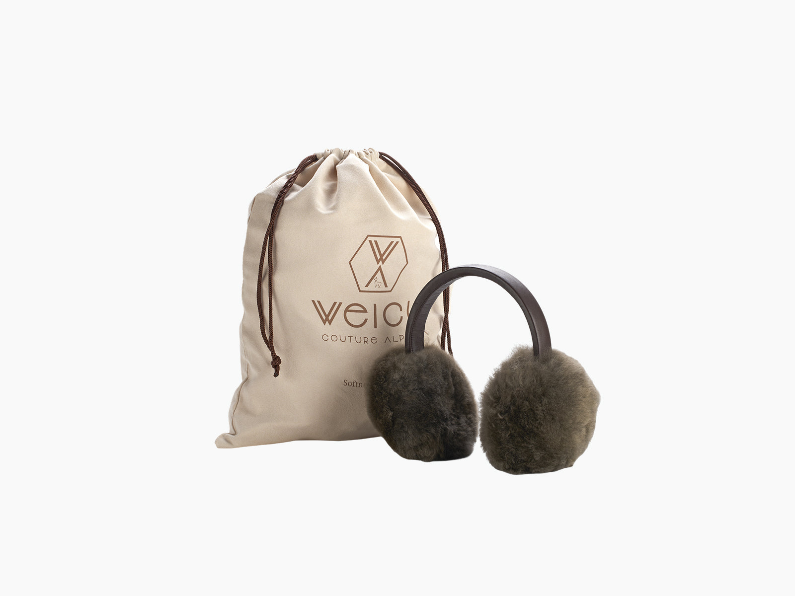 Dark brown alpaca ear warmers with a leather band beside a beige drawstring pouch with WEICH logo