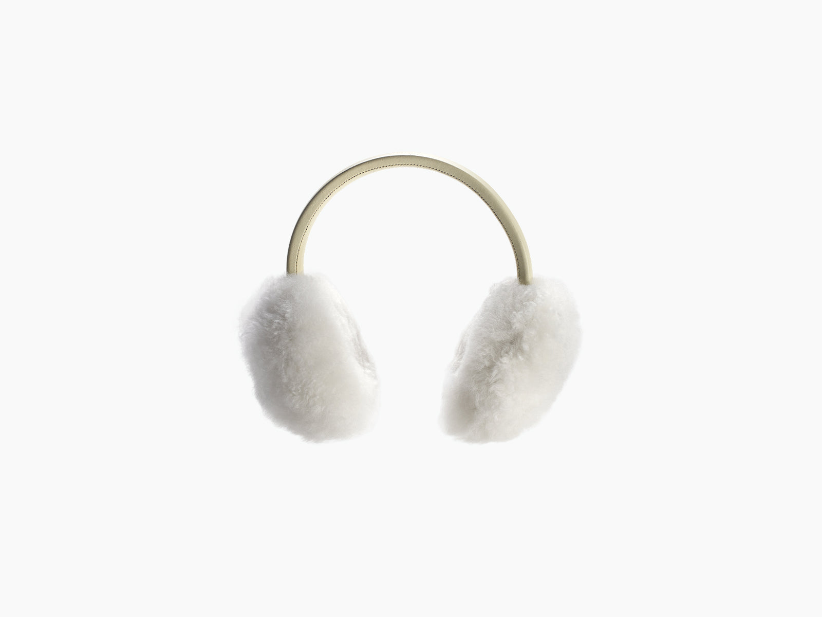 White fluffy ear warmers with a light beige headband.
