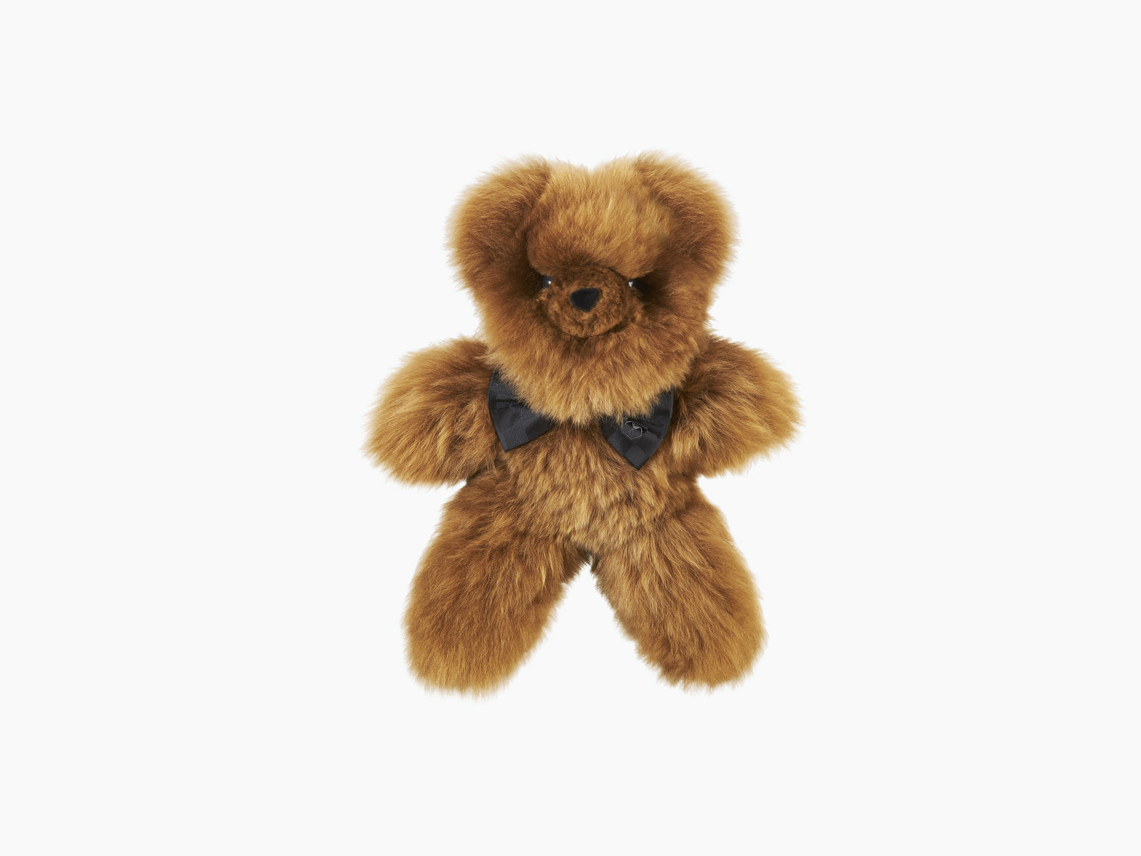 Brown plush teddy bear with a black silk bow tie