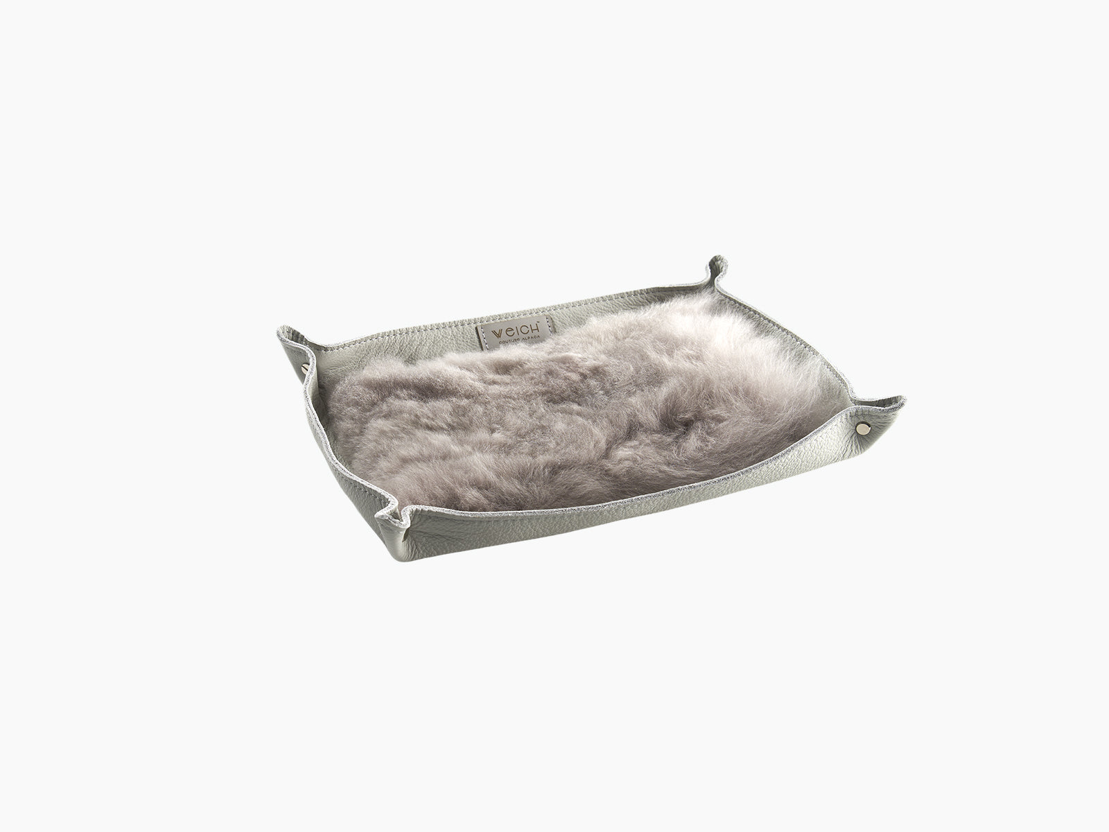 Grey leather catchall tray with plush alpaca lining and a WEICH label