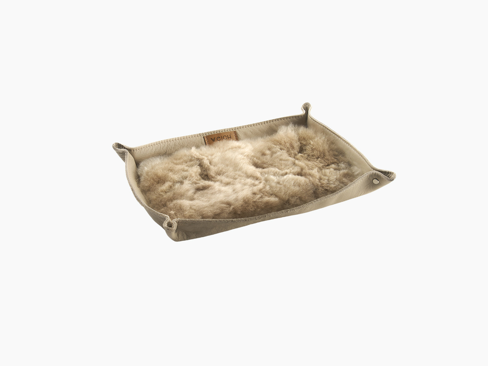 Large beige leather catchall tray with a plush alpaca lining for jewelry and essentials