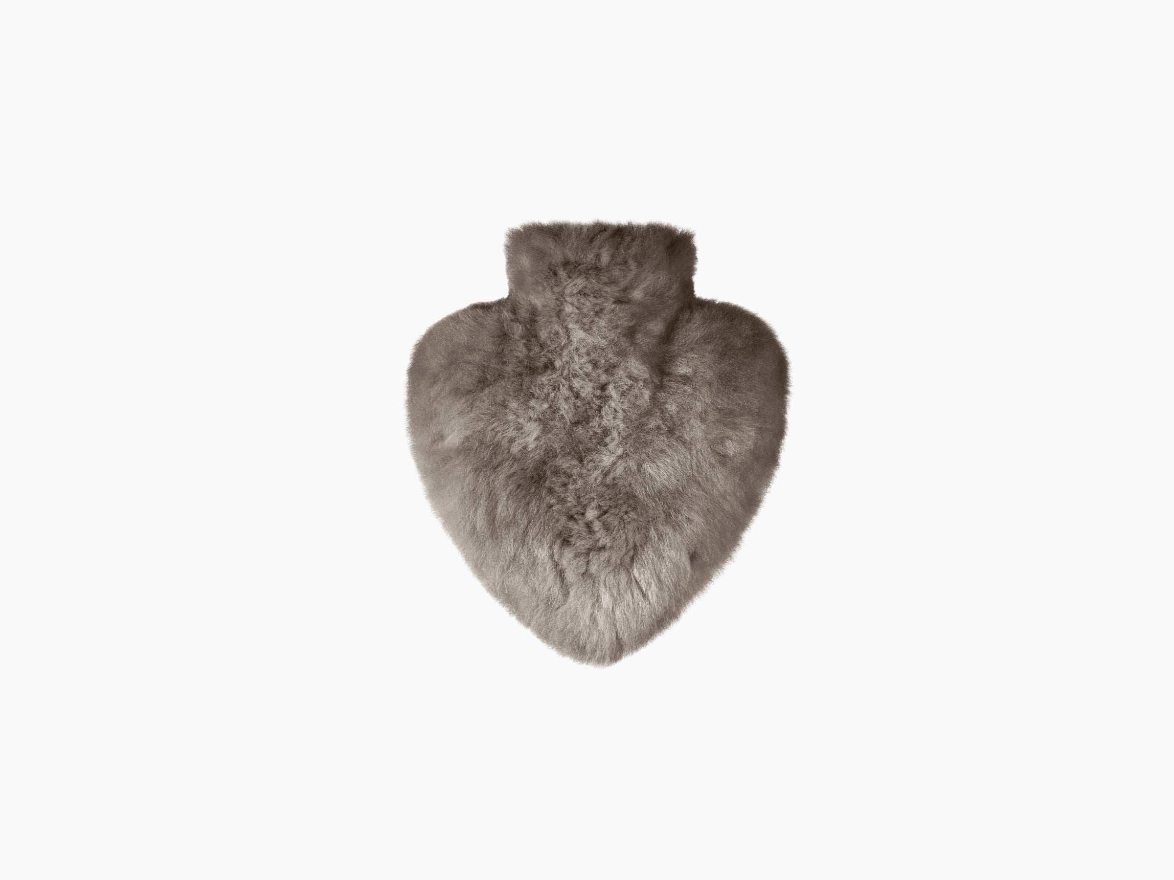 Taupe heart shaped alpaca hot water bottle in front of a beige WEICH gift box.