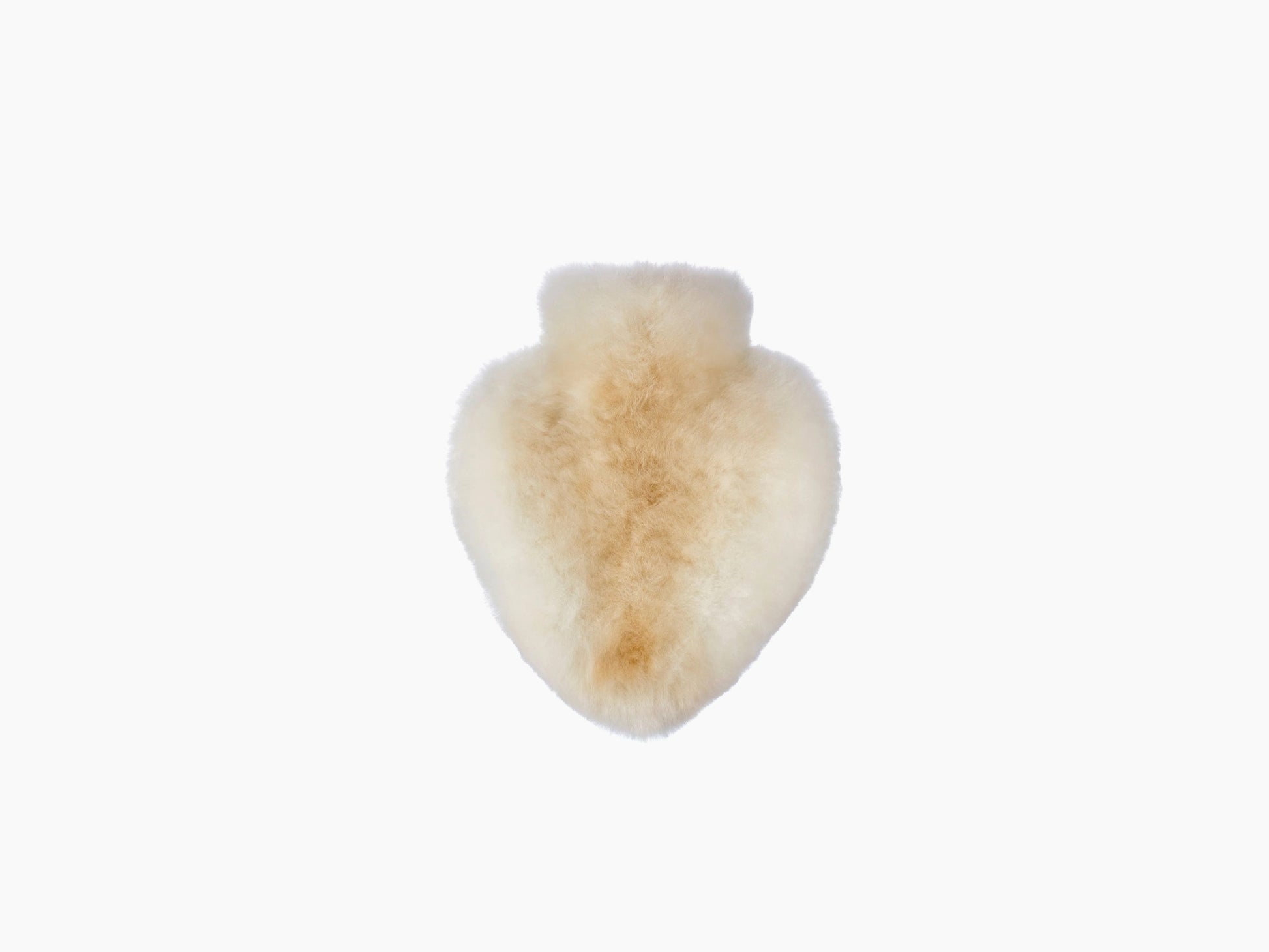 Heart shaped plush alpaca fiber accessory in warm light tan