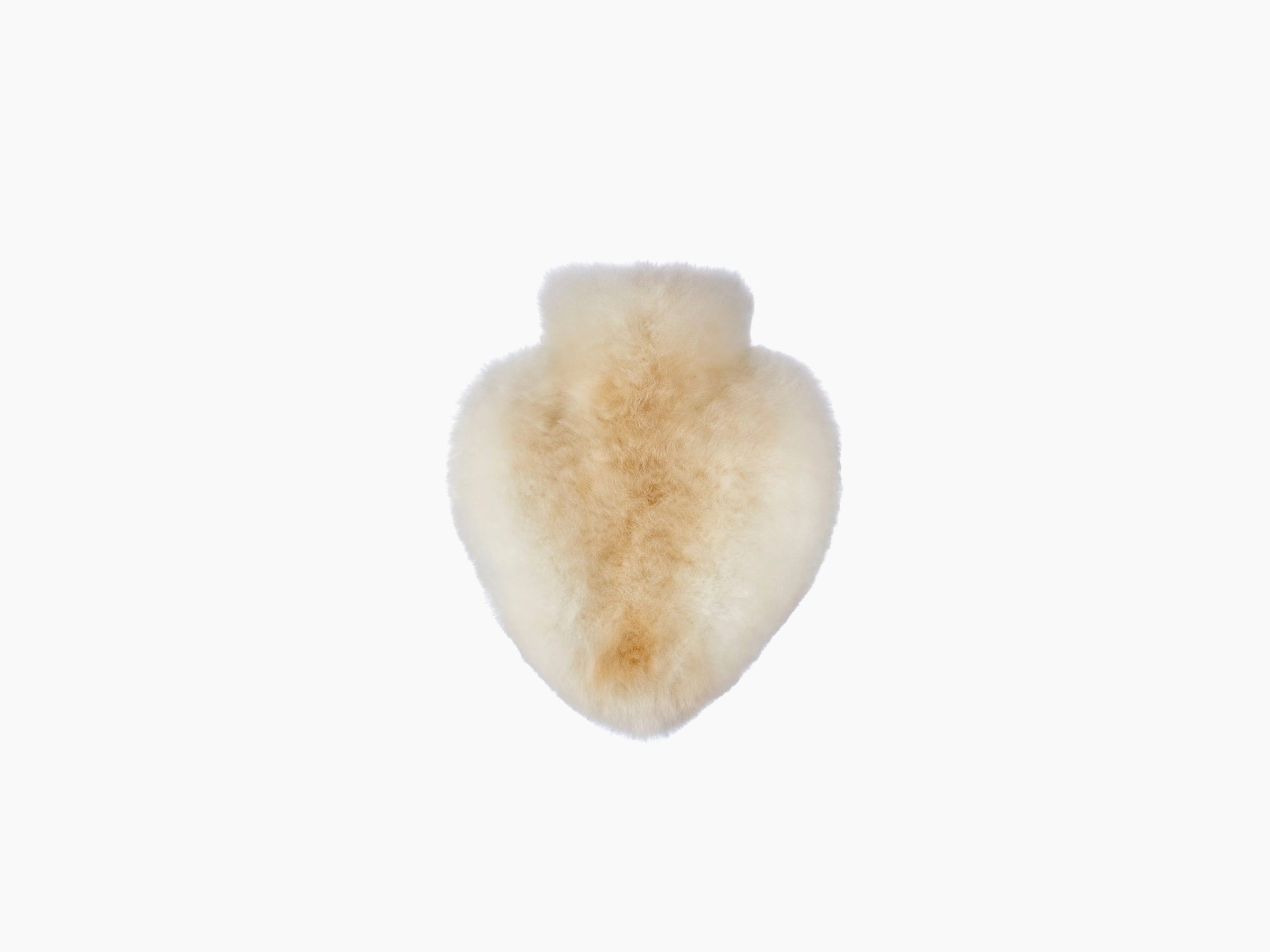 Heart shaped plush alpaca fiber accessory in warm light tan